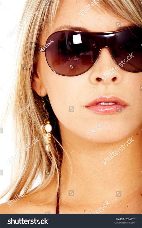 Beautiful Blond Fashion Woman Wearing Sunglasses Over A White