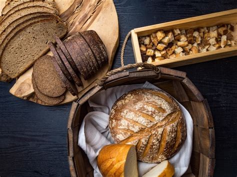 Premium Photo Assortment Of Baked Bread On Wooden Background