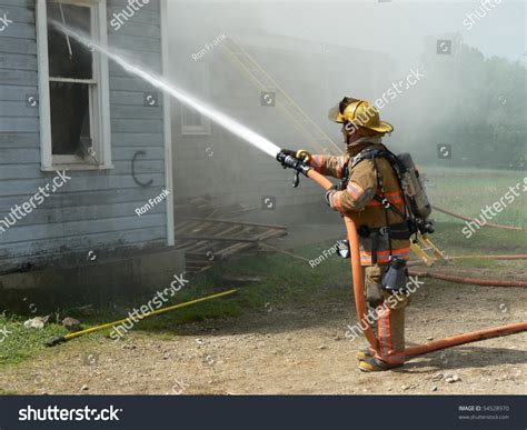 Firefighter Spraying Water Stock Photo 54528970 Shutterstock