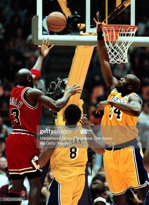 News Photo Michael Jordan Goes Up For A Layup But Shaquille