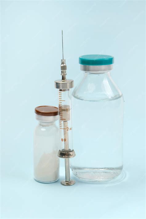 Premium Photo | Set for injections side view on a blue background