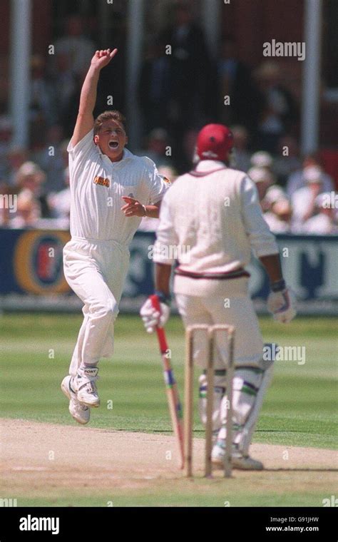 England S Darren Gough Left Celebrates Taking The Wicket Of West