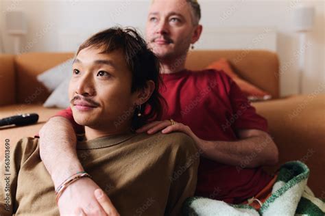 Young Happy Asian And Caucasian Same Sex Interracial Couple At Home