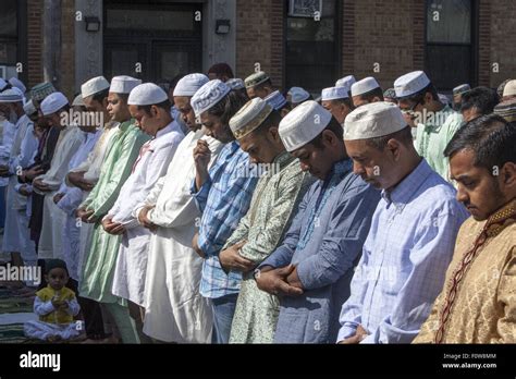 Muslims pray outside a mosque in Kensington, Brooklyn, NY for "Eid al ...