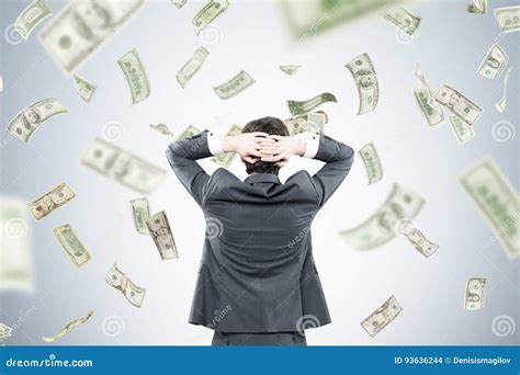 Businessman With Hands Behind Head In Money Flow Stock Photo Image Of