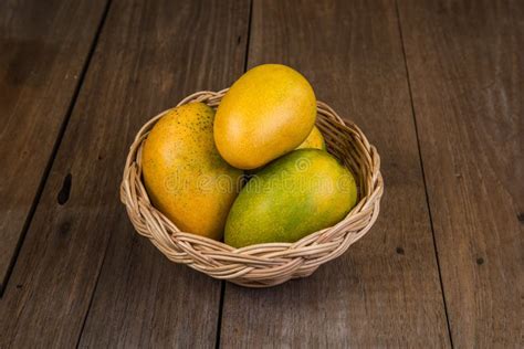 Ripe Mango In Basket On Wooden Table Tropical Fruit Group Of Fresh