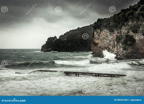 Dramatic Landscape With Cliffs On Sea Shore During Storm With Big