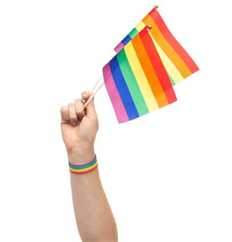 Premium Photo Hand With Gay Pride Rainbow Flags And Wristband