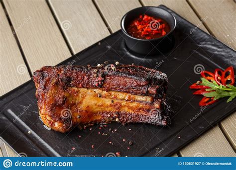 Grilled And Barbecue Hot Pork Ribs With Hot Chilli Pepper And Hot Sauce