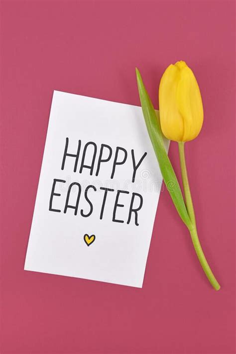 `happy Easter` Written On White Card With Yellow Tulip Spring Flower On