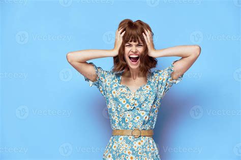 Woman In Dress Holding His Head With His Mouth Open Stylish Clothes