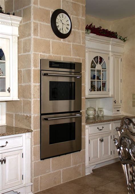 Ovens Installed In A Wall Of Tile In The Kitchen On Three Sides Can