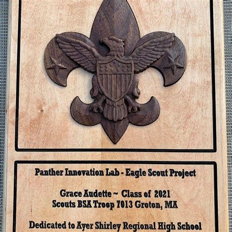 An Award Plaque Is Displayed On A Wooden Plaque That Reads Father