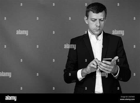 Handsome Businessman With Short Hair Against Gray Background Stock