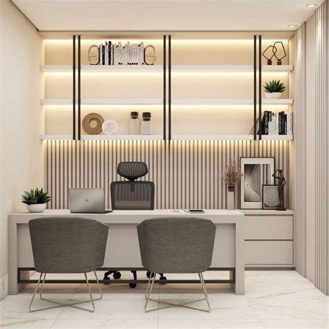 Two Gray Chairs Sitting At A Desk In An Office