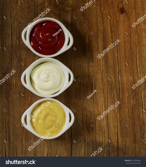 Mustard Ketchup And Mayonnaise Three Kinds Of Sauces Stock Photo