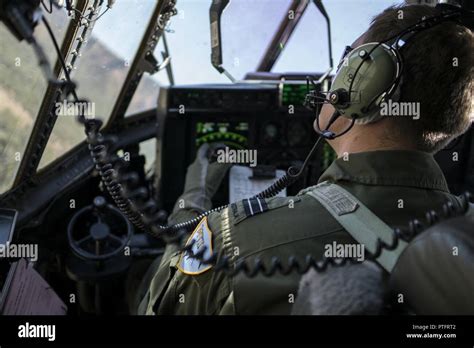 A No 37 Squadron Royal Australian Air Force Pilot Looks Out The Window