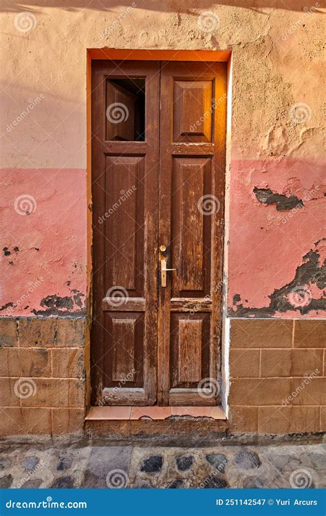 Old Damaged Wooden Door Of An Abandoned Weathered Building Vintage