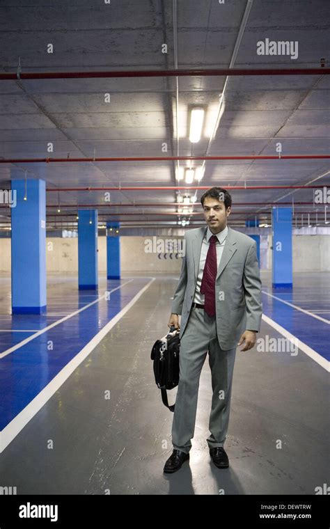 Businessman. Parking lot Stock Photo - Alamy