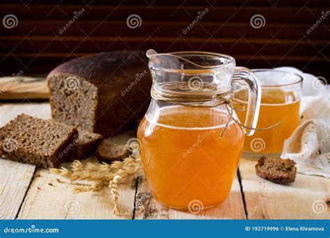 Traditional Russian Cold Rye Drink Kvas In A Glass And A Jug On The