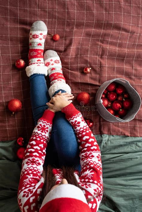 Top View Female Legs With Christmas Socks On The Bed With Decorations Stock Image Image Of