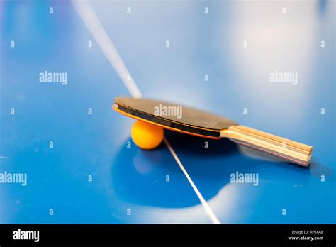 Closeup Of Ping Pong Or Table Tennis Racket Blue Vibrant Orange Color