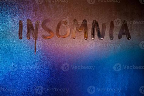 Word Insomnia Handwritten On Night Wet Window Glass Close Up 12670316