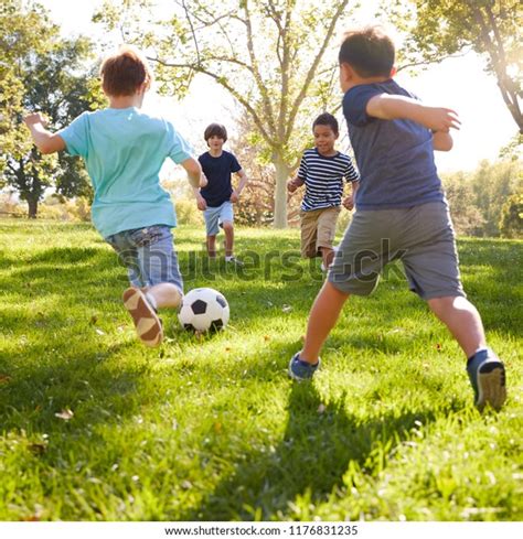 Four Schoolboys Playing Football Park Square Stock Photo 1176831235 ...