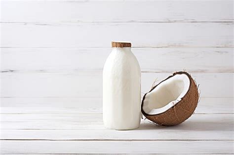 Premium Photo Bottle Of Coconut Milk Put On White Wooden Background