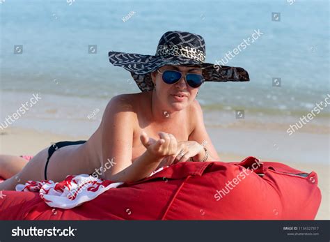 Woman Nude Black Hat Sunglasses Lies Stock Photo 1134327317 Shutterstock