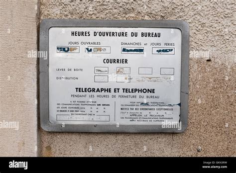 Standard Opening Hours Sign Outside A French Post Office Stock Photo