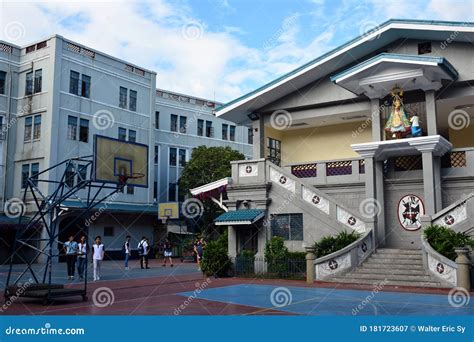 Colegio De San Juan Letran Building Facade With Mary Statue In Manila