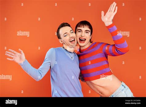 Cheerful Attractive Gay Friends With Vivid Makeup Posing Together On
