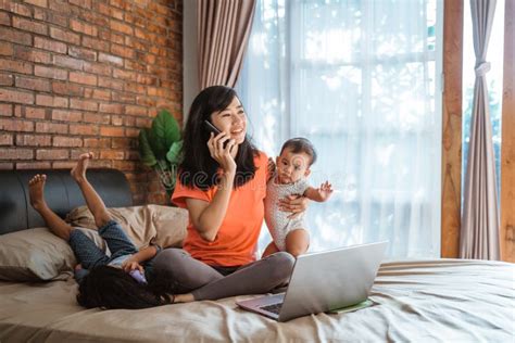 Asian Woman Working While Taking Care Children Stock Image Image Of