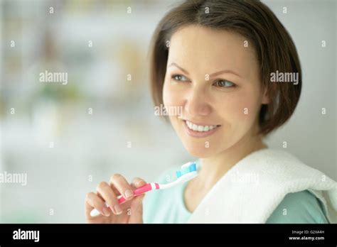 Woman Brushing Her Teeth Stock Photo Alamy