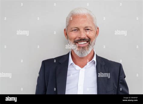 Portrait Of A Smiling Mature Businessman Stock Photo Alamy