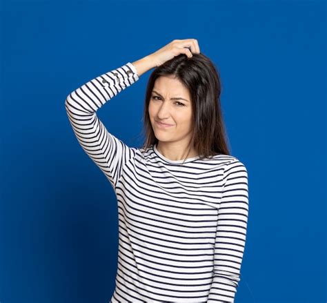 Premium Photo Brunette Young Woman Wearing A Striped T Shirt