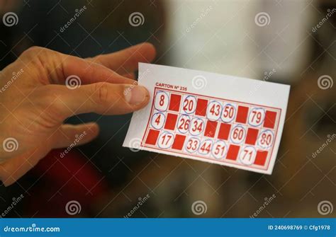 Person Playing Bingo Woman`s Hands Holding Cardboard From Bingo Game