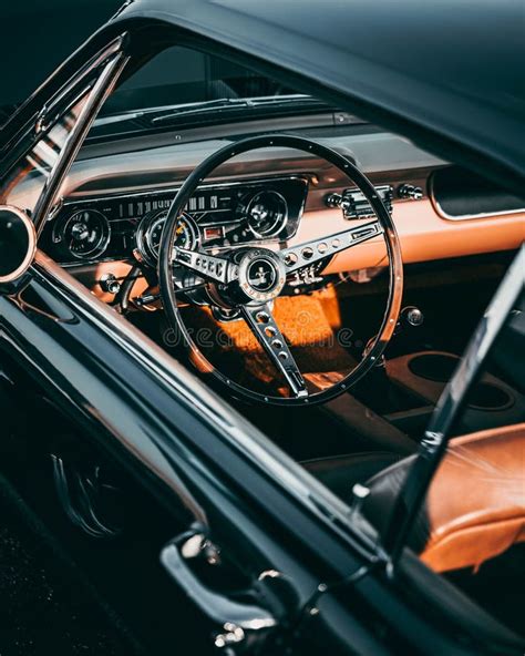 Vertical View of the Interior of Ford Mustang GT350 with Orange Leather and Vintage Dashboard ...