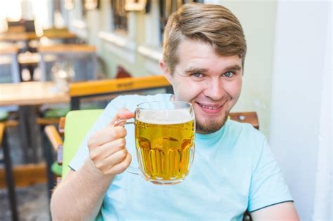 Premium Photo Portrait Of Smiling Man Drinking Glass