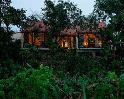 Overlapping Shingle Roofs Shield Tien Cam House In Vietnam