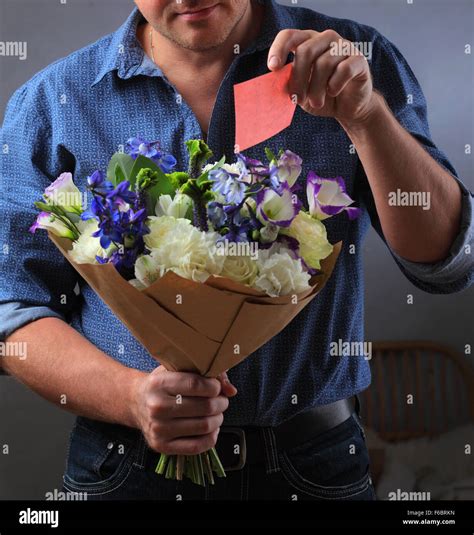 Man Holding A Bouquet Of Flowers A Man Makes A Proposal To A Woman A