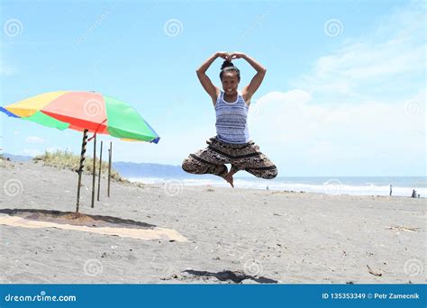 Girl Levitating in Yoga Pose on Beach Stock Image - Image of angle ...