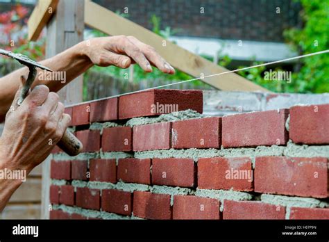 Bricklayer With Trowel In Hand Stock Photo Alamy