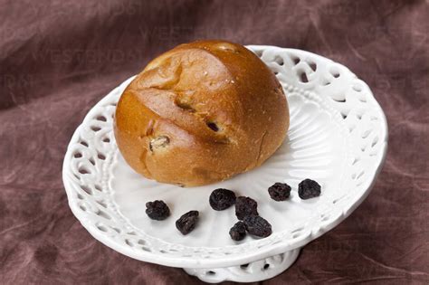 Currant Bun On Dessert Stand Close Up Stock Photo