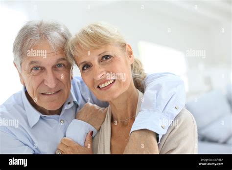 Happy Senior Man Embracing His Wife Stock Photo Alamy