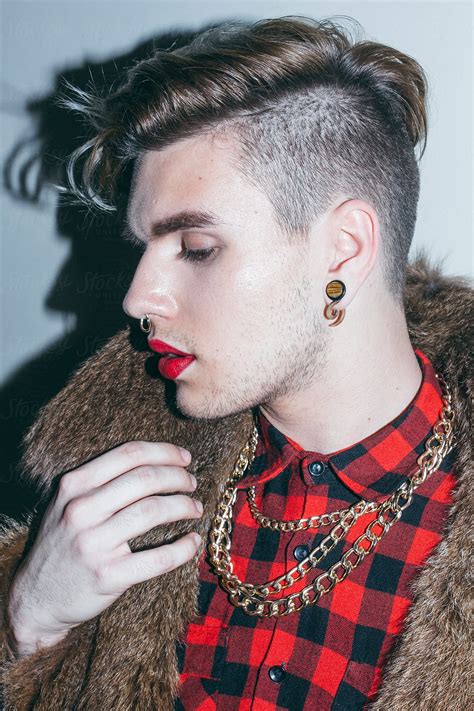 Beautiful Young Man With Red Lipstick And Golden Necklace In A Fur Coat Fashion Hairstyle