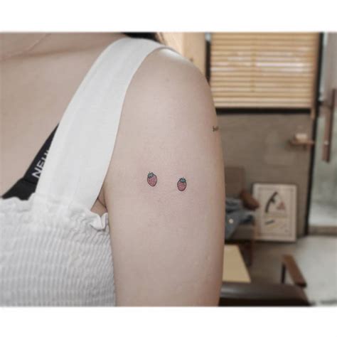 Tiny Minimalistic Strawberries Tattooed On The Upper