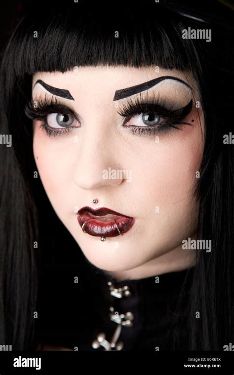 Gothic looking girl with face piercings Stock Photo: 69358042 - Alamy