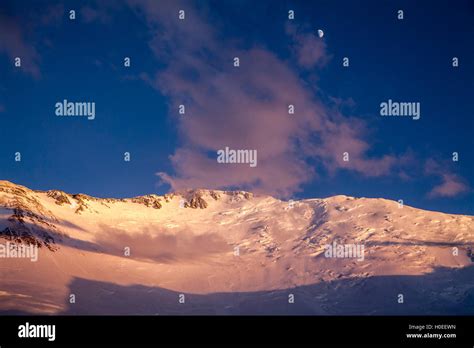 Gold sunset and summit of Lenin peak. Pamir mountains. Kyrgyzstan Stock ...